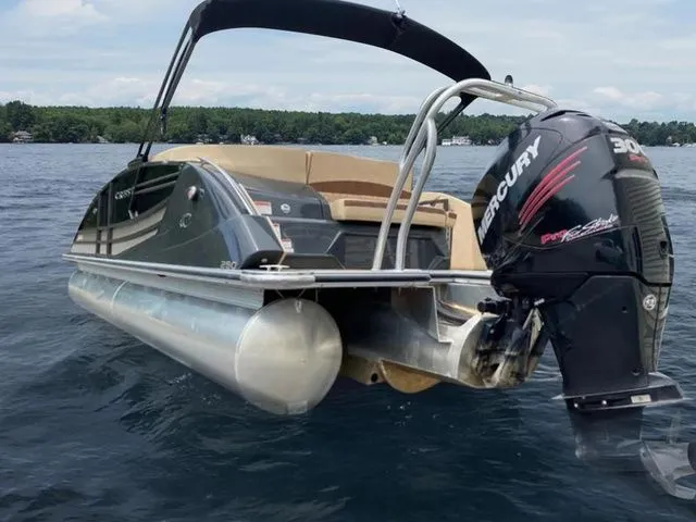 Slide: The Image of 2017 Crest Savannah 250 NX L pontoon boat with Mercury engine on a lake. - 4