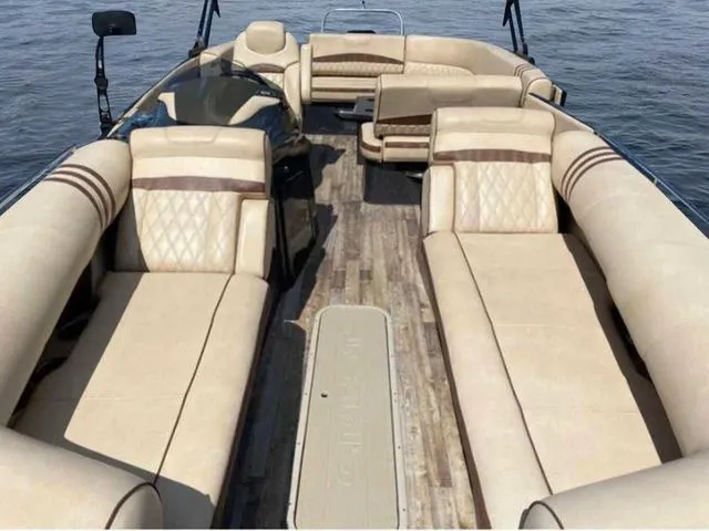 Slide: The Image of 2017 Crest Savannah 250 NX L pontoon boat with luxurious beige seating on the water. - 5