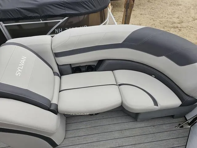 Slide: The Image of 2022 Sylvan L-3 CLZ boat seating with gray and black upholstery on deck. - 4