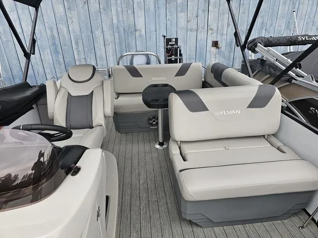 Slide: The Image of 2022 Sylvan L-3 CLZ pontoon boat interior with plush seating and modern design. - 5