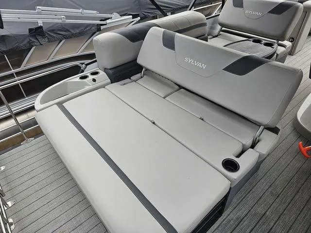 Slide: The Image of 2022 Sylvan L-3 CLZ boat interior with gray seating and cup holders. - 6