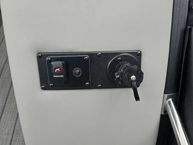 Slide: The Image of Control panel on 2022 Sylvan L-3 CLZ boat featuring washdown switch and socket. - 7