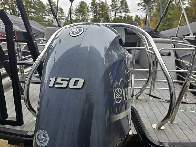 Slide: The Image of 2022 Sylvan L-3 CLZ boat with Yamaha 150 outboard motor, docked outdoors. - 9