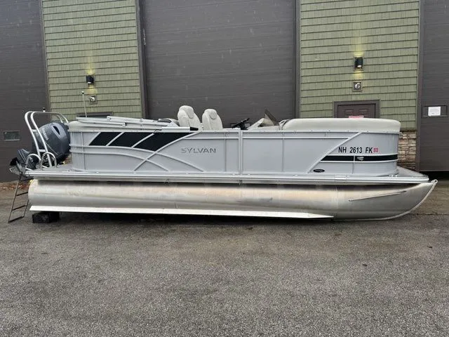 Slide: The Image of 2022 Sylvan 8522 LZ pontoon boat parked outdoors, side view. - 1