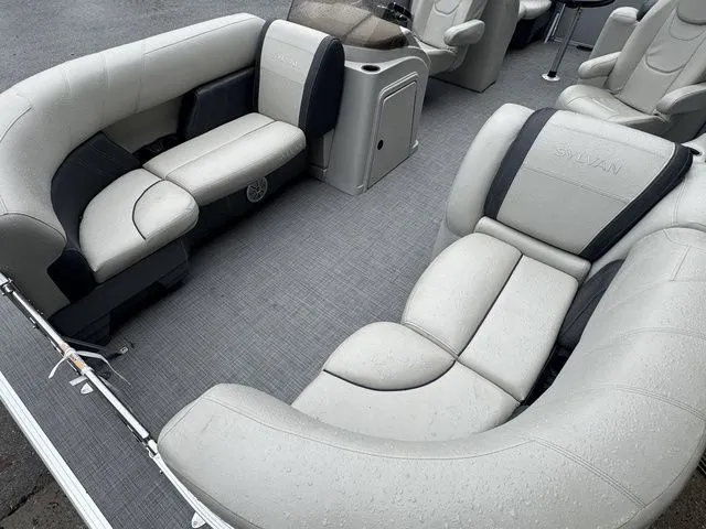Slide: The Image of Luxurious seating on 2022 Sylvan 8522 LZ pontoon boat, featuring sleek gray upholstery. - 10