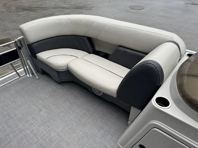 Slide: The Image of 2022 Sylvan 8522 LZ boat interior with gray and white seating. - 12