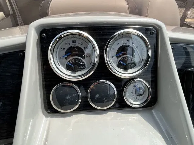 Slide: The Image of Dashboard of 2022 Sylvan 8520 LZ boat with gauges and controls. - 13