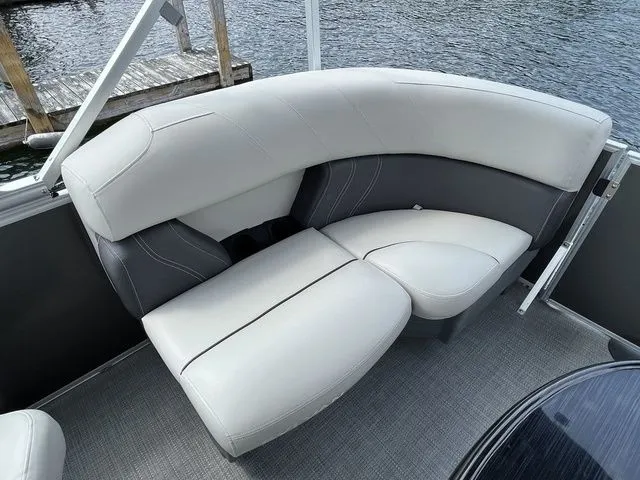 Slide: The Image of Luxurious seating on 2022 Sylvan 8520 LZ pontoon boat, featuring sleek gray and white upholstery. - 17