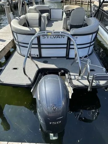 Slide: The Image of 2022 Sylvan X1 pontoon boat with Yamaha 150 engine docked at marina. - 3