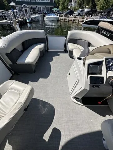 Slide: The Image of Interior of 2022 Sylvan X1 boat with spacious seating and modern dashboard. - 6