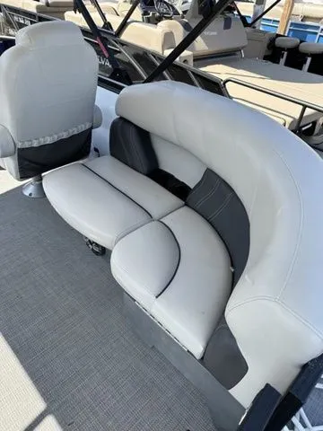 Slide: The Image of 2022 Sylvan X1 boat interior with plush gray seating and modern design. - 7