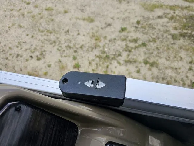 Slide: The Image of Remote control for Sylvan 8522 CRS SG boat, 2023 model, on a metallic surface. - 5