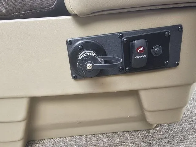 Slide: The Image of 2023 Sylvan 8522 CRS SG boat control panel with washdown switch and power outlet. - 9