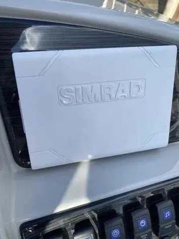 Slide: The Image of 2023 Sylvan X1 dashboard featuring a Simrad navigation system. - 14