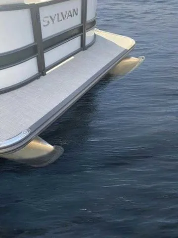 Slide: The Image of 2023 Sylvan X1 pontoon boat on calm water. - 3