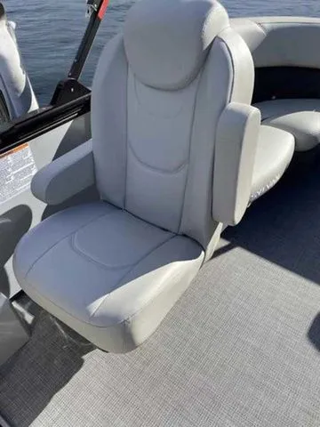 Slide: The Image of 2023 Sylvan X1 boat seat with gray upholstery and armrests. - 8