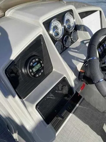 Slide: The Image of Dashboard of 2023 Sylvan X1 boat with steering wheel and control gauges. - 9