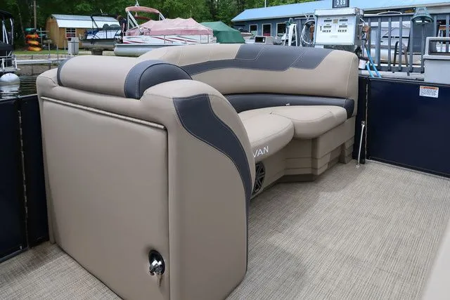 Slide: The Image of 2023 Sylvan L-3 DLZ BAR boat interior with beige and gray seating. - 13