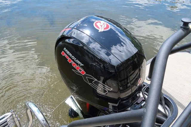 Slide: The Image of 2023 Sylvan L-3 DLZ BAR boat with Mercury Pro XS outboard motor on water. - 17