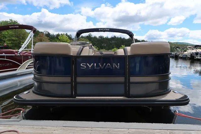 Slide: The Image of 2023 Sylvan L-3 DLZ BAR pontoon boat docked on a sunny day. - 5