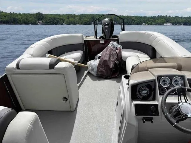 Slide: The Image of 2023 Sylvan X3 CLZ pontoon boat interior on a lake. - 10