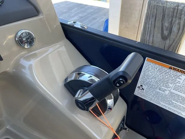 Slide: The Image of 2023 Sylvan L-5 CLZ boat throttle control with warning label and sleek design. - 13