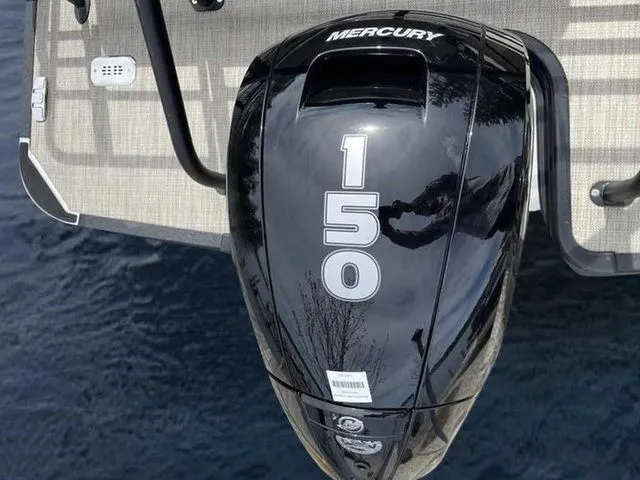 Slide: The Image of Mercury 150 outboard motor on 2023 Sylvan L-1 DLZ boat, docked on water. - 10