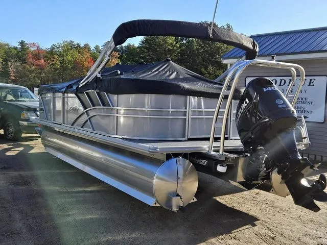 Slide: The Image of 2023 Sylvan 8524 Mirage LZ pontoon boat with Suzuki outboard motor, parked outdoors. - 4