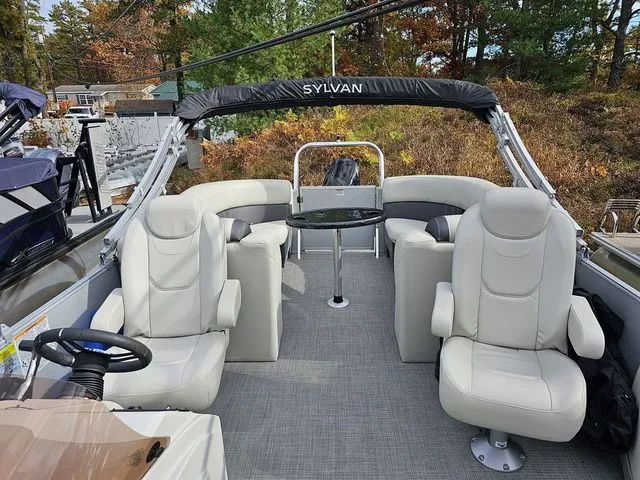 Slide: The Image of 2023 Sylvan 8524 Mirage LZ pontoon boat with plush seating and sleek design. - 9