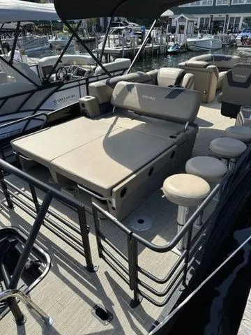 Slide: The Image of 2023 Sylvan L-5 DLZ Bar pontoon boat with spacious seating and modern design. - 5
