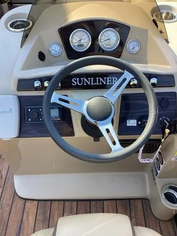 Slide: The Image of 2018 Harris 230 Sunliner Sport dashboard with steering wheel and gauges. - 12