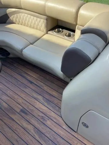 Slide: The Image of Luxurious seating on 2018 Harris 230 Sunliner Sport with cup holders and wood-style flooring. - 14