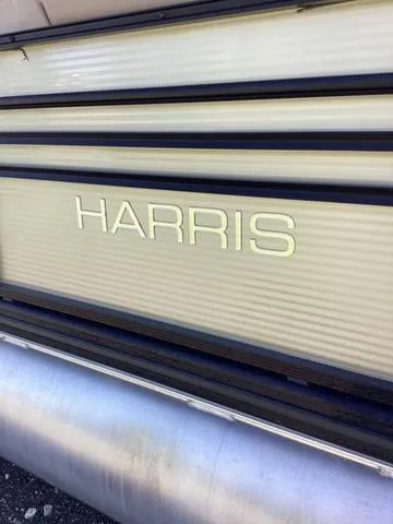 Slide: The Image of 2018 Harris 230 Sunliner Sport pontoon boat, side view with logo. - 5