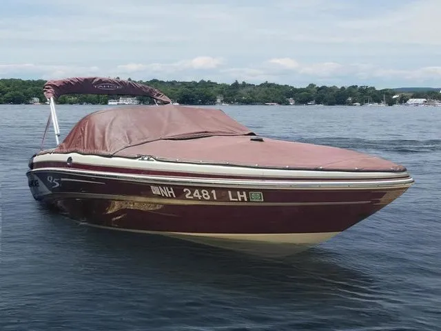 Slide: The Image of 2013 Tahoe Q5i boat with cover on a lake, registration NH 2481 LH. - 3