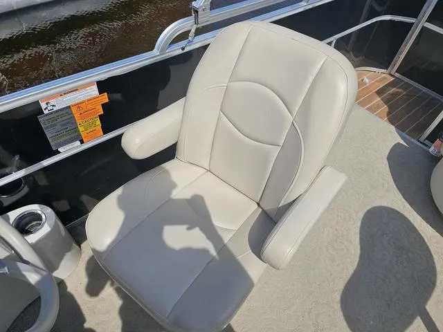 Slide: The Image of Captain's chair on 2012 South Bay 522 CR pontoon boat, beige upholstery. - 10