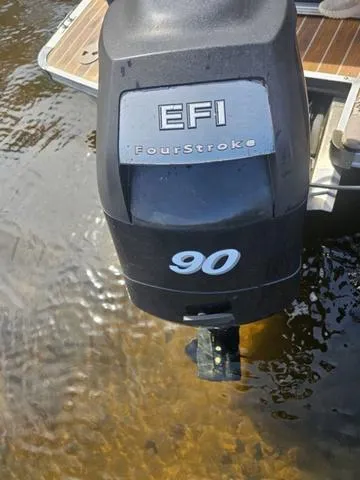 Slide: The Image of EFI FourStroke 90 horsepower outboard motor on a 2012 South Bay 522 CR boat. - 13