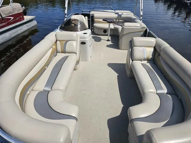 Slide: The Image of 2012 South Bay 522 CR pontoon boat with spacious seating on calm water. - 4