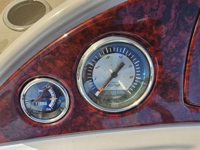 Slide: The Image of Dashboard of 2012 South Bay 522 CR boat with RPM and trim gauges. - 8