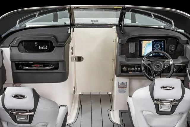 Slide: The Image of 2025 Chaparral 2870 SSX boat interior with modern dashboard and navigation system. - 9