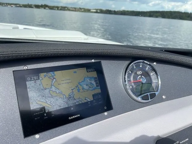 Slide: The Image of Dashboard of 2023 Cobalt CS22 boat with Garmin navigation system on a lake. - 29