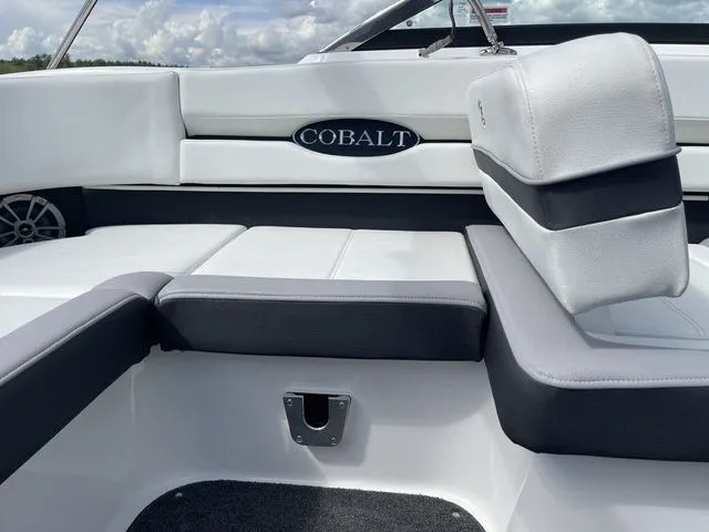 Slide: The Image of 2023 Cobalt CS22 boat interior with white and gray seating, showcasing luxury design. - 36