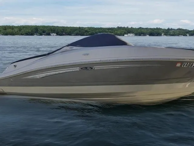 Slide: The Image of 2007 Sea Ray 210 Select boat on calm lake waters. - 1