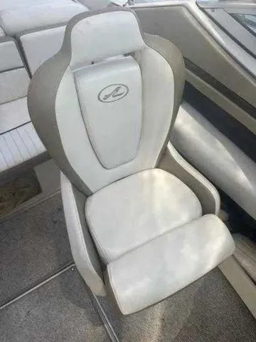 Slide: The Image of 2007 Sea Ray 210 Select boat seat, white and gray upholstery, sleek design. - 10