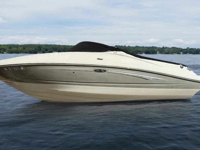 Slide: The Image of 2007 Sea Ray 210 Select boat on a calm lake with a scenic background. - 11