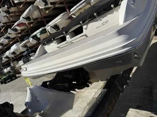 Slide: The Image of 2007 Sea Ray 210 Select boat in storage, rear view, showcasing sleek design. - 4