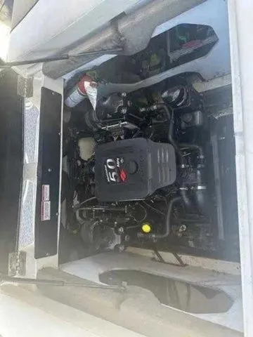 Slide: The Image of Engine compartment of a 2007 Sea Ray 210 Select boat, showcasing the motor details. - 5