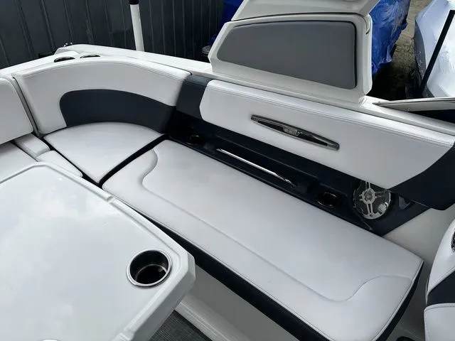 Slide: The Image of 2019 Chaparral 277SX boat interior with white and gray seating. - 10