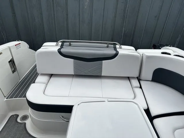 Slide: The Image of 2019 Chaparral 277SX boat interior with white and gray seating. - 11