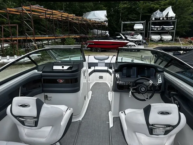 Slide: The Image of 2019 Chaparral 277SX boat interior with modern dashboard and seating. - 13