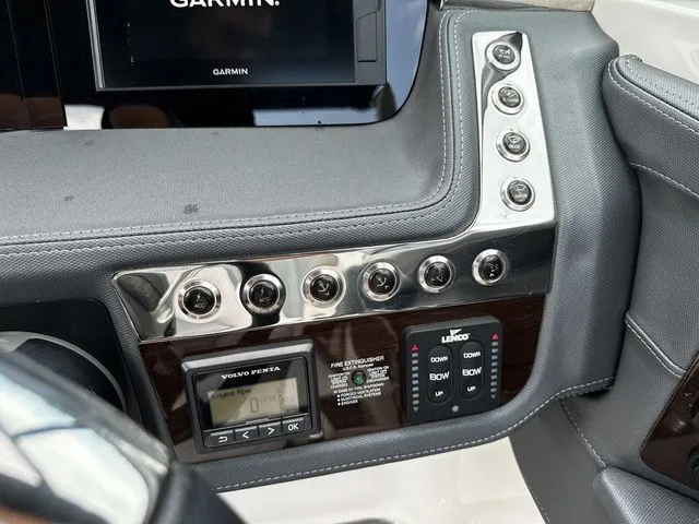 Slide: The Image of Control panel of a 2019 Chaparral 277SX boat with Garmin display and Volvo Penta controls. - 19